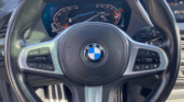 Volant BMW Série 1 grise – finition M Sport d'une voiture compacte d'occasion à Perpignan / voiture occasion Perpignan